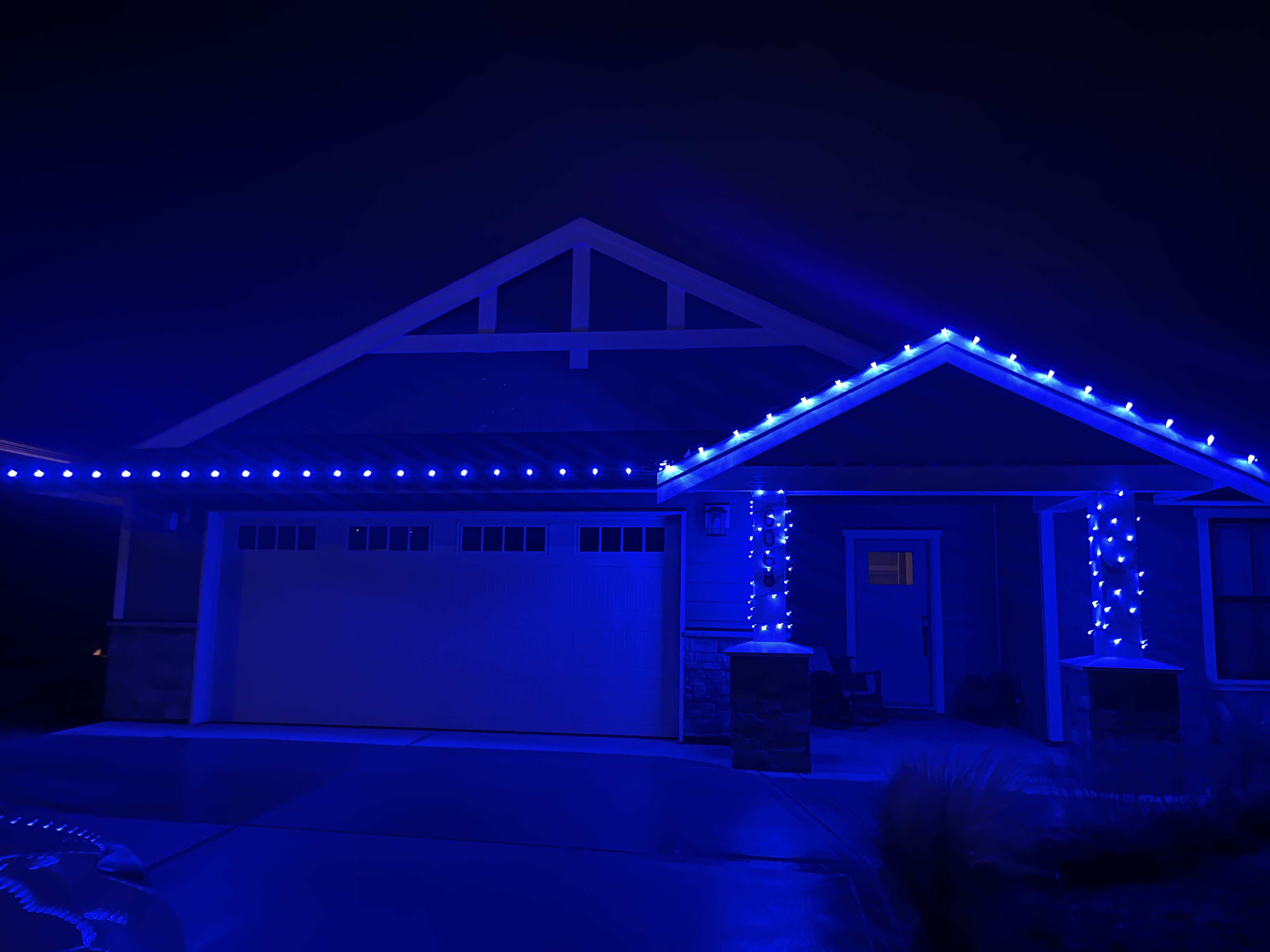 Blue holiday light installation Roberts Creek BC